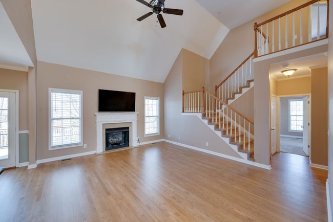 Extra large living room with a cozy fireplace and gas logs. | Image 6