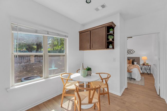 Dining space with light wood finished floors and baseboards | Image 13