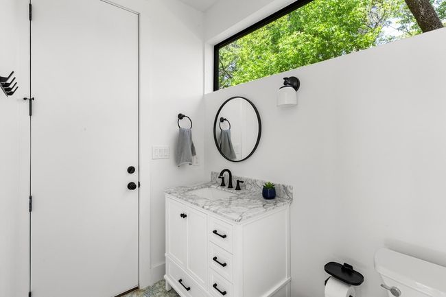 Bathroom with toilet and vanity | Image 36