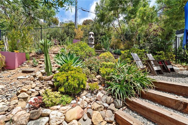 Lush landscape and seating area. | Image 22