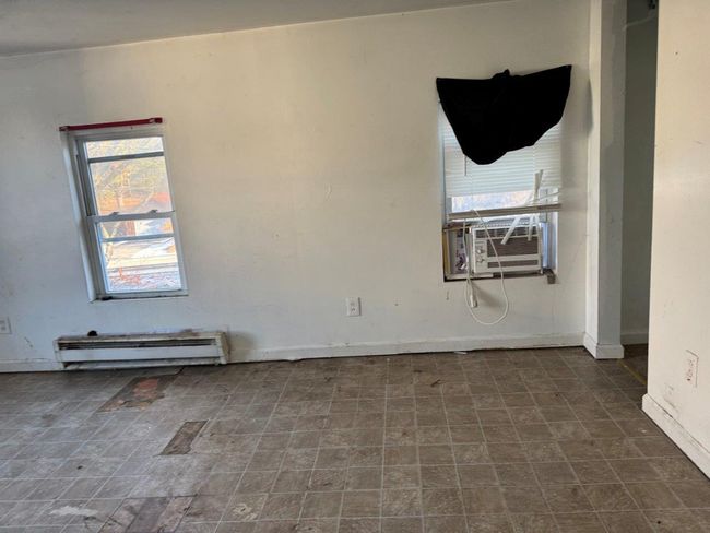 Spare room with cooling unit and a baseboard radiator | Image 5