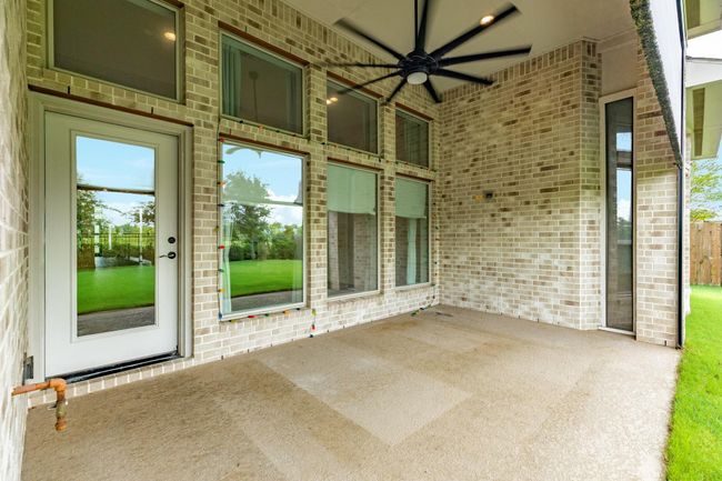 The covered patio has an automatic screen that will enclose the patio or open for a fantastic view of the waterfront. | Image 39