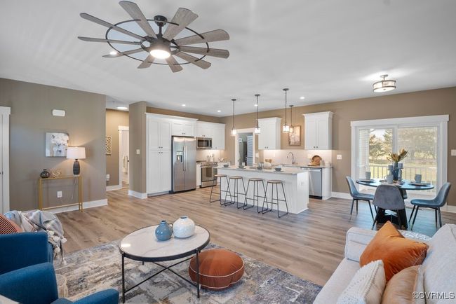 Living room featuring recessed lighting, light wood-style flooring, baseboards, and ceiling fan | Image 6