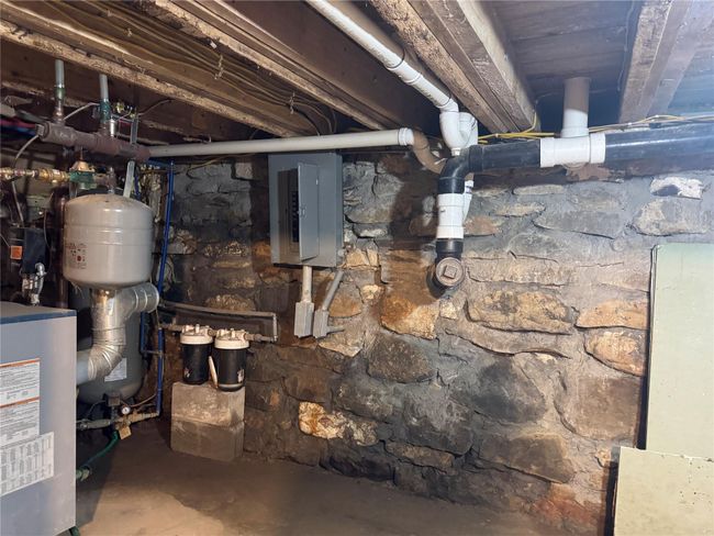 Utility room with electric panel and a heating unit | Image 21