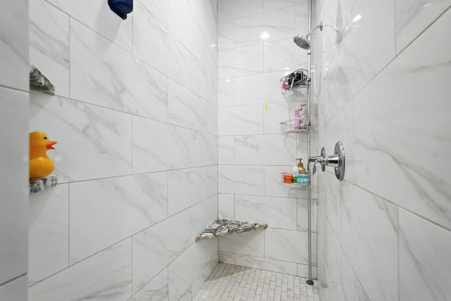 Full bathroom featuring a tile shower | Image 18