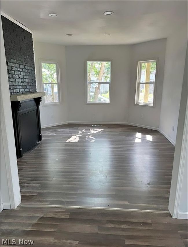 Unfurnished living room with hardwood / wood-style floors | Image 2