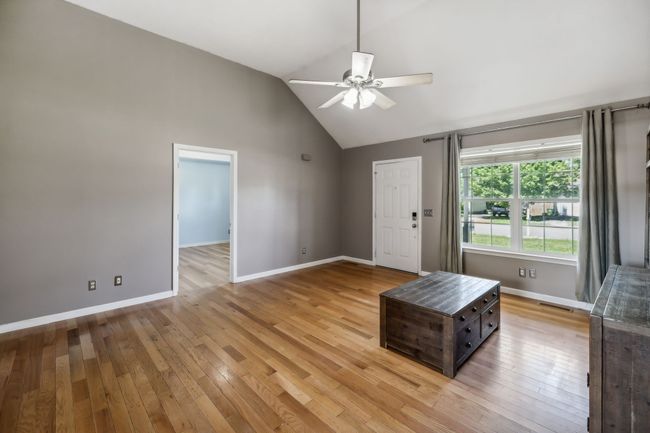 The living area, illuminated by natural light streaming through a double window reflects off of the bamboo flooring, and includes a ceiling fan to move the air! 2095 Bolden Drive, Murfreesboro, TN 37127 | Image 6