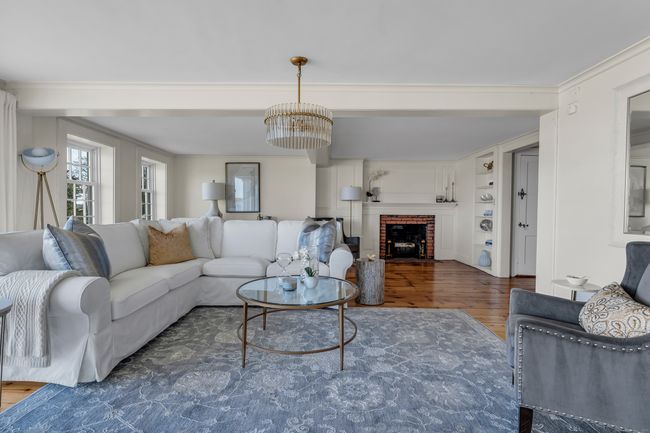 The Formal Living Room With A Charming Fireplace Offers The Perfect Balance Of Relaxed And Refined | Image 17