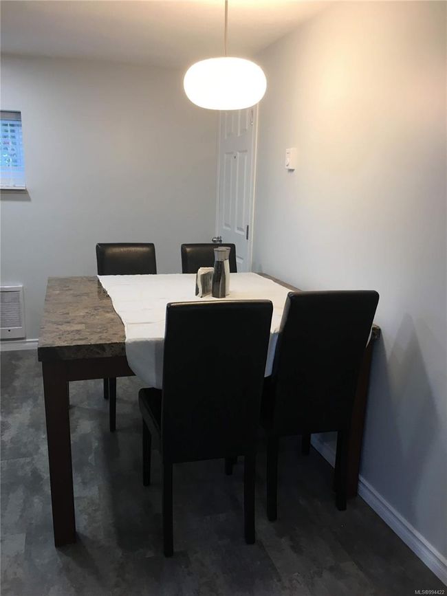 Dining space with baseboards | Image 18