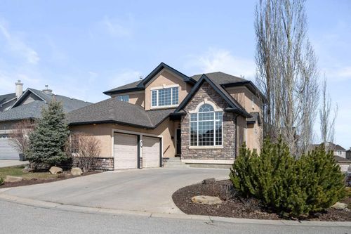 32 Evercreek Bluffs Crescent Sw, Home with 4 bedrooms, 3 bathrooms and 4 parking in Calgary AB | Card Image