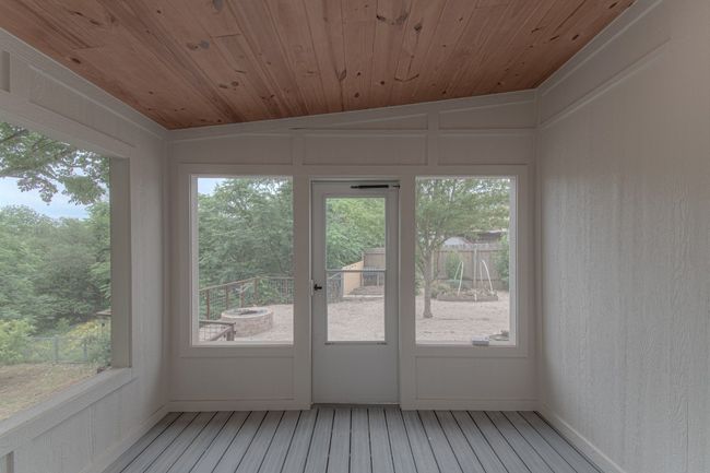 Your screened in porch leads you outside to your second outdoor seating area. | Image 26