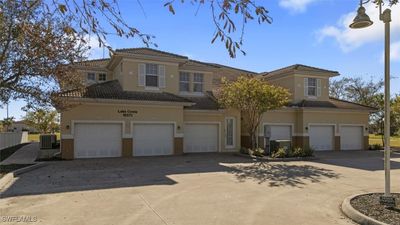 View of front of house featuring central AC unit and a garage | Image 2