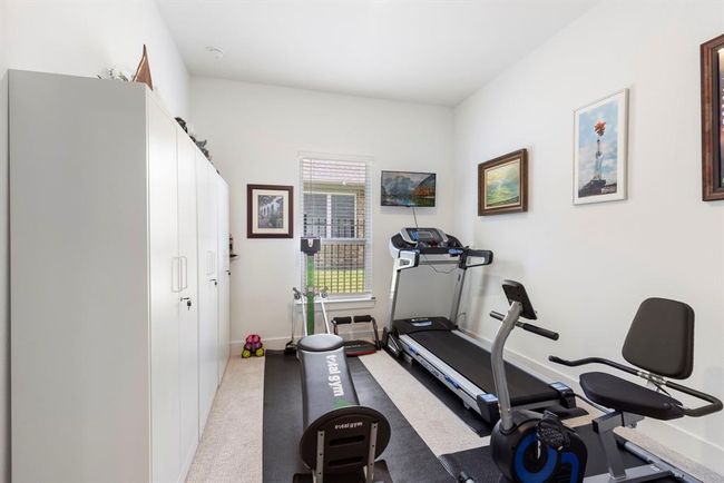 Versatile downstairs bedroom, ideal for a home gym or personal retreat. | Image 33