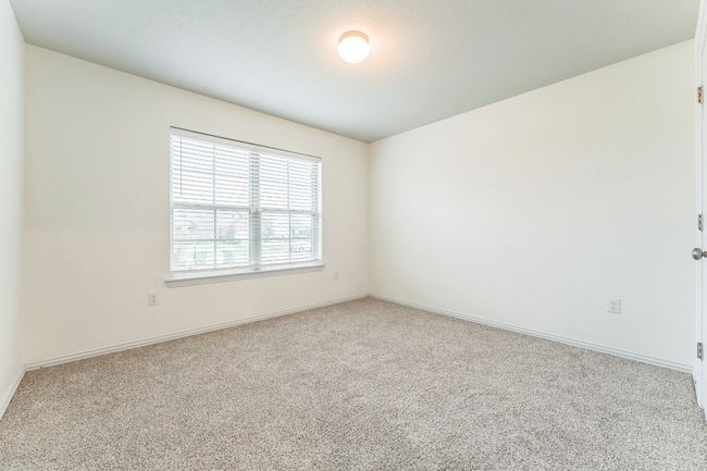 Carpeted empty room featuring baseboards | Image 9
