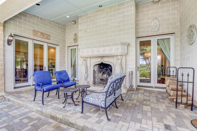 View of patio with french doors and a fireplace | Image 30