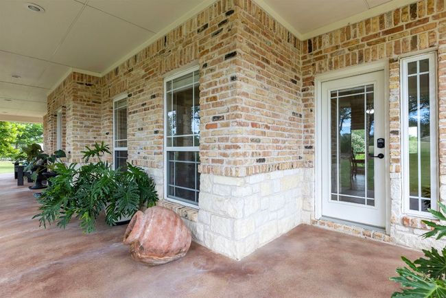 Front porch and side entry door into kitchen. | Image 4