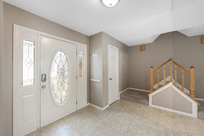 Welcoming front entrance with staircase to the left and a coat closet. | Image 3