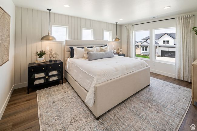 Bedroom with wood finished floors, baseboards, multiple windows, and recessed lighting | Image 18