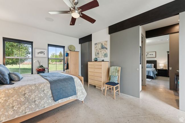 Bedroom featuring a ceiling fan | Image 24