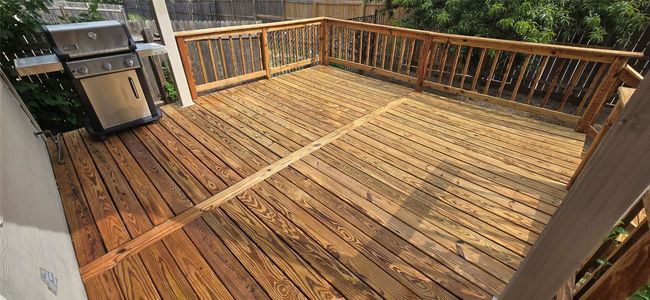 Wooden terrace featuring a grill | Image 31