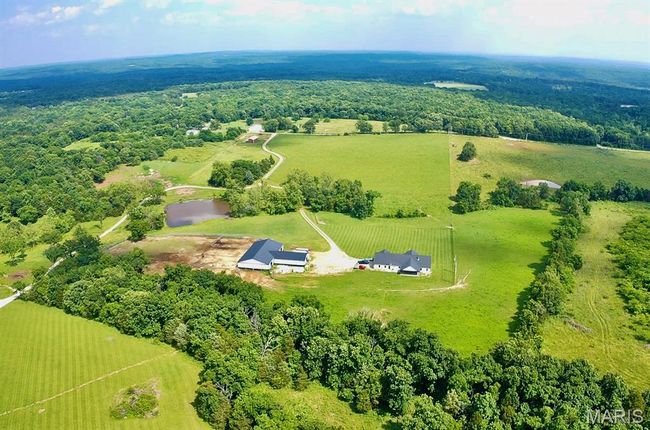 Aerial view of property and surrounding area with rural landscape and a forest | Image 8