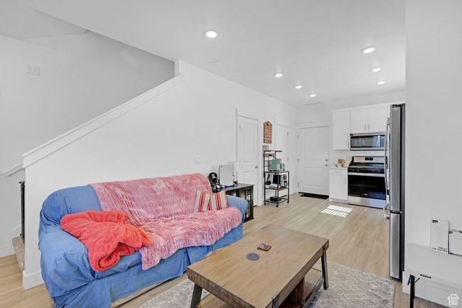Living room with light wood finished floors and recessed lighting | Image 4