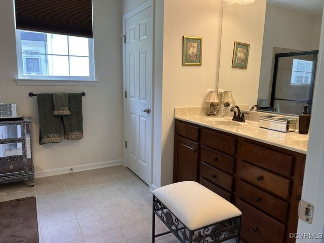 Bathroom with vanity and an enclosed shower | Image 32