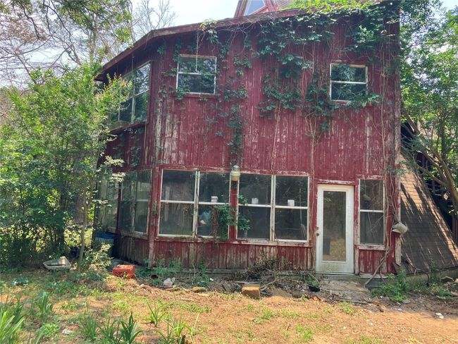 A-Frame House in need of repair or removal. Property is secluded with mature native trees. | Image 14