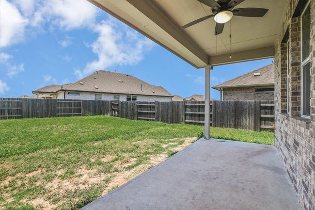 View of yard with ceiling fan and a patio | Image 26