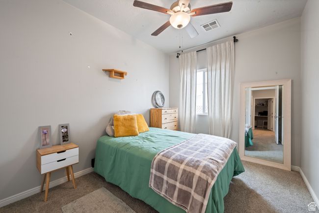 Carpeted bedroom featuring baseboards and ceiling fan | Image 23