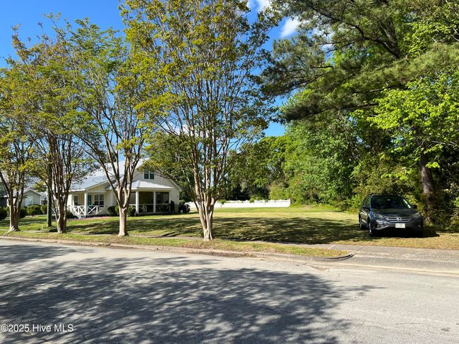 Cleared lot, driveway entrance in place | Image 4