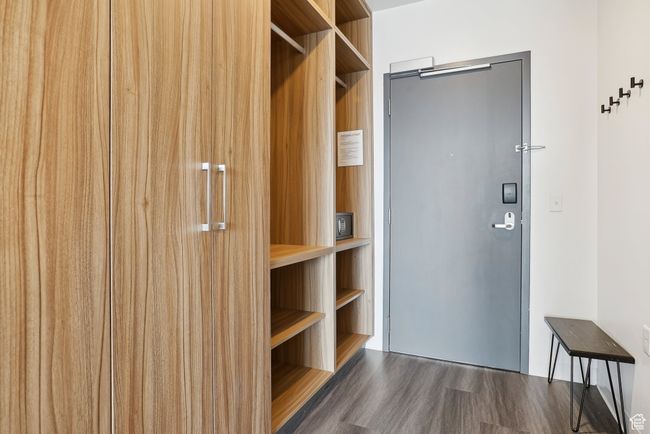 Spacious closet with wood finished floors | Image 14