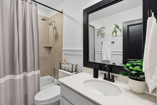 A full bath is accessible just outside the bedroom door. | Image 29