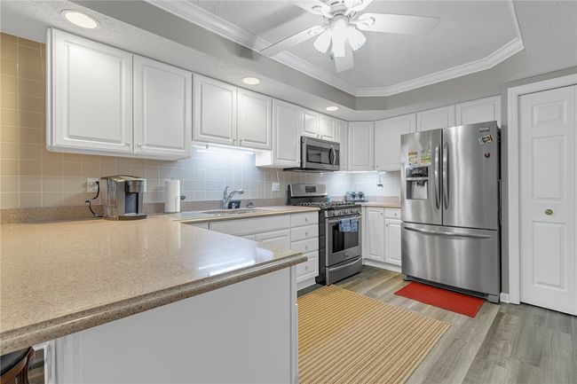 Welcome to the cooks dream kitchen. So much counter space and cabinetry. You can see the large pantry to the right of the picture. All stainless steel appliances stay. | Image 6
