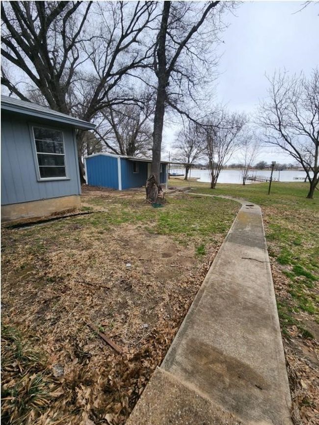 View of yard featuring a water view | Image 21
