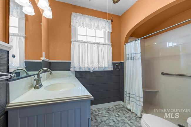 Full bathroom with vanity and a shower with curtain | Image 41