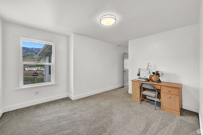 Carpeted home office with baseboards | Image 32