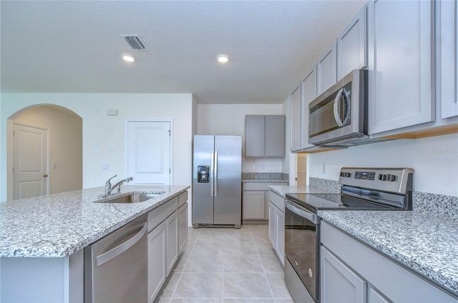 9176 Forge Breeze Loop, House other with 5 bedrooms, 3 bathrooms and null parking in WESLEY CHAPEL FL | Image 6