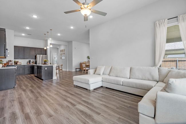 Living area featuring recessed lighting, light wood-style floors, and ceiling fan | Image 10
