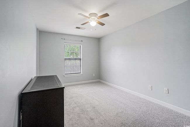 Unfurnished room featuring ceiling fan and carpet flooring | Image 15