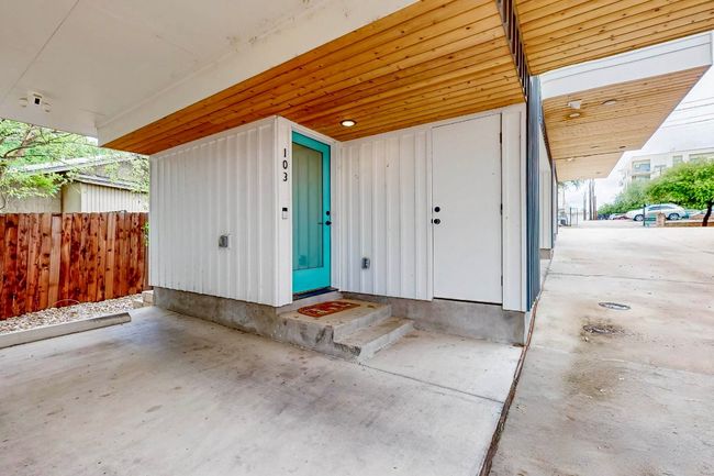 Entrance to property featuring board and batten siding | Image 29