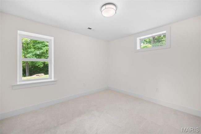 Empty room with light carpet and baseboards | Image 41