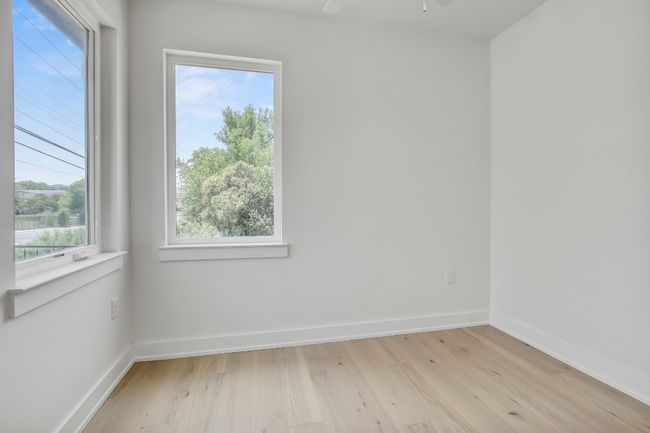 Unfurnished room with light wood-style flooring, baseboards, and ceiling fan | Image 24