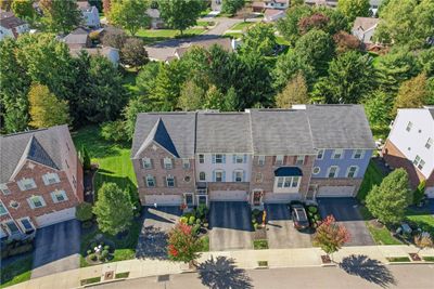 With tree lined streets and lush landscaping. One of the few locations in all of Park Place that enjoys a private tree lined backyard. Most others have other units behind the townhome. | Image 2