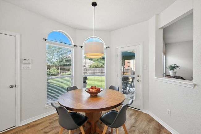 Dining space with light wood-style flooring | Image 16