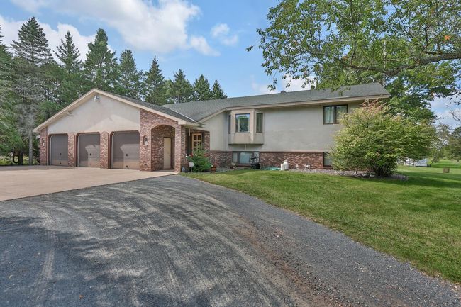 One owner home is built solid. Large concrete apron in front of the garage. | Image 27