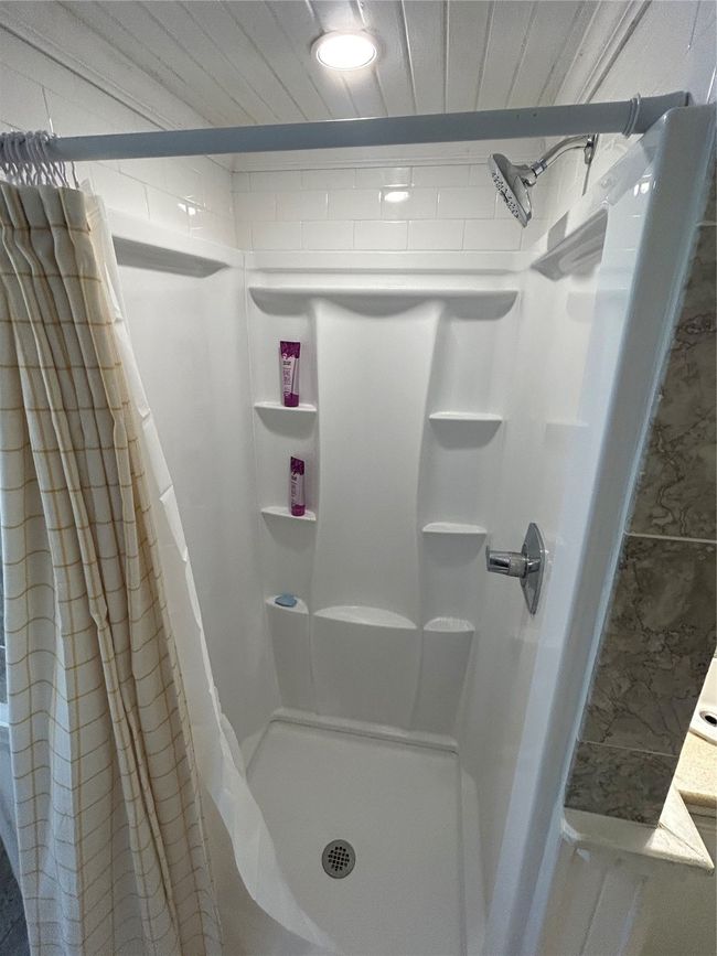 Bathroom with a shower stall | Image 19