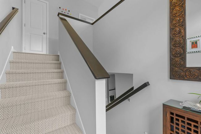 Stairs feature newer carpeting. | Image 32