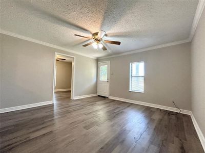 Spacious living area with LVP flooring | Image 2