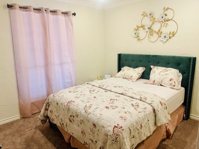 Carpeted bedroom with crown molding and baseboards | Image 15